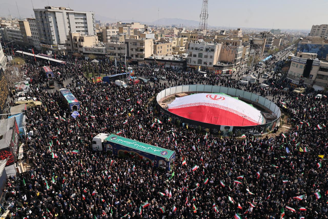 Iranian mourners gather during the funeral of Iran's security chief Ali Larijani and Gholamreza Soleimani, a senior officer in the Islamic Revolutionary Guard Corps who commands Basij forces, in Tehran on March 18, 2026. (AFP Photo)