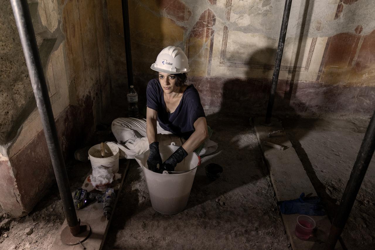 Restorers at work inside the House of Julius Polybius open to the public during European Archaeology Days at the archaeological site of Pompeii, Italy, June 12, 2026. (AA Photo)