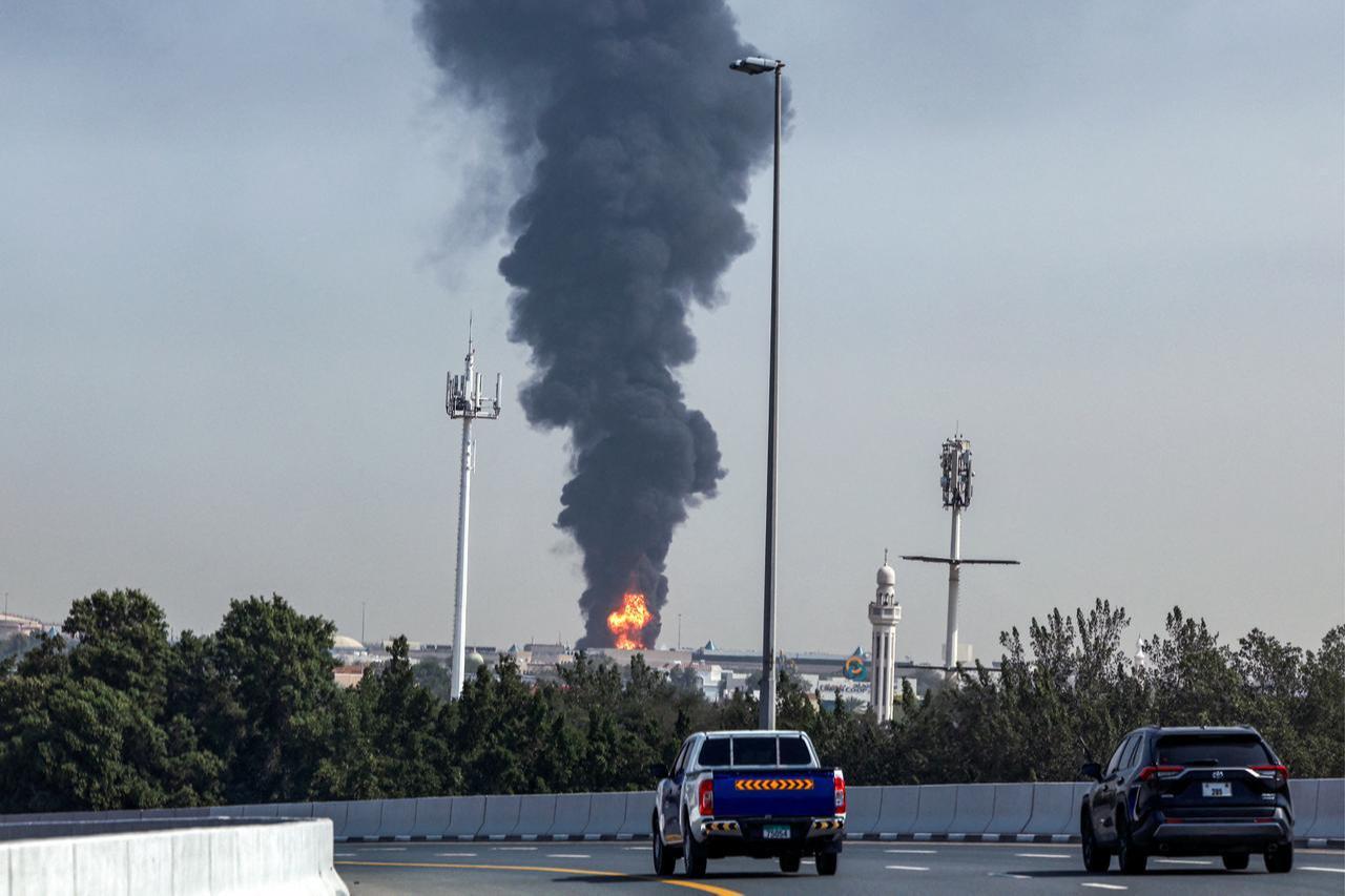 A smoke plume rises from an ongoing fire at Dubai International Airport in Dubai on March 16, 2026. (AFP Photo)