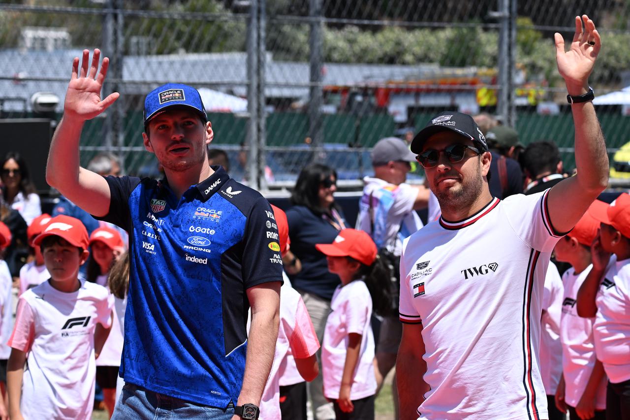 Max Verstappen of Red Bull Racing and Sergio Perez of Cadillac greet the fans during the parade held ahead of the Barcelona-Catalunya Grand Prix, on June 14, 2026. (AA Photo)
