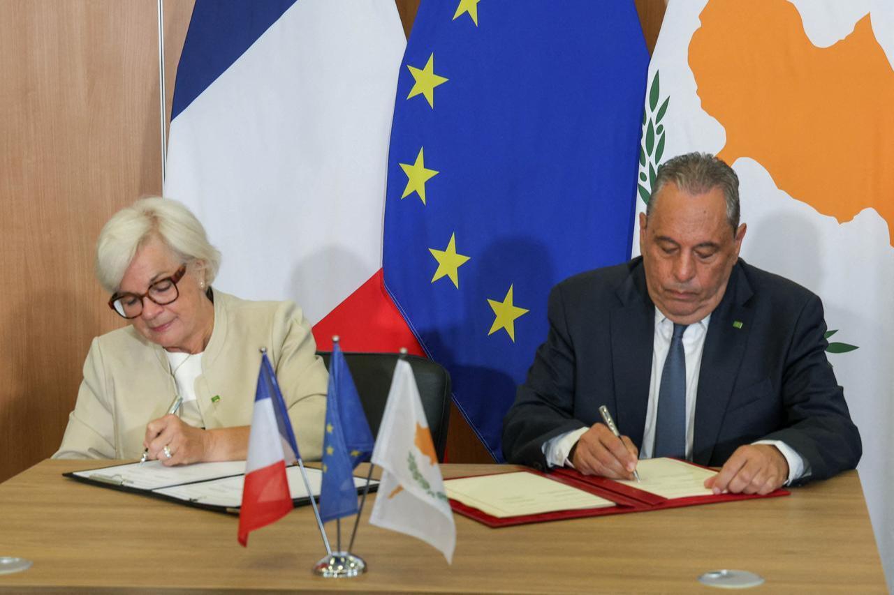France's Defense Minister Catharine Vautrin and her Greek Cypriot counterpart Vasilis Palmas sign a Status of Forces Agreement (SOFA) in Nicosia, June 8, 2026. (Photo by Spiros  GIAGKOU/Cyprus Presidency of the Council of the EU 2026/AFP)