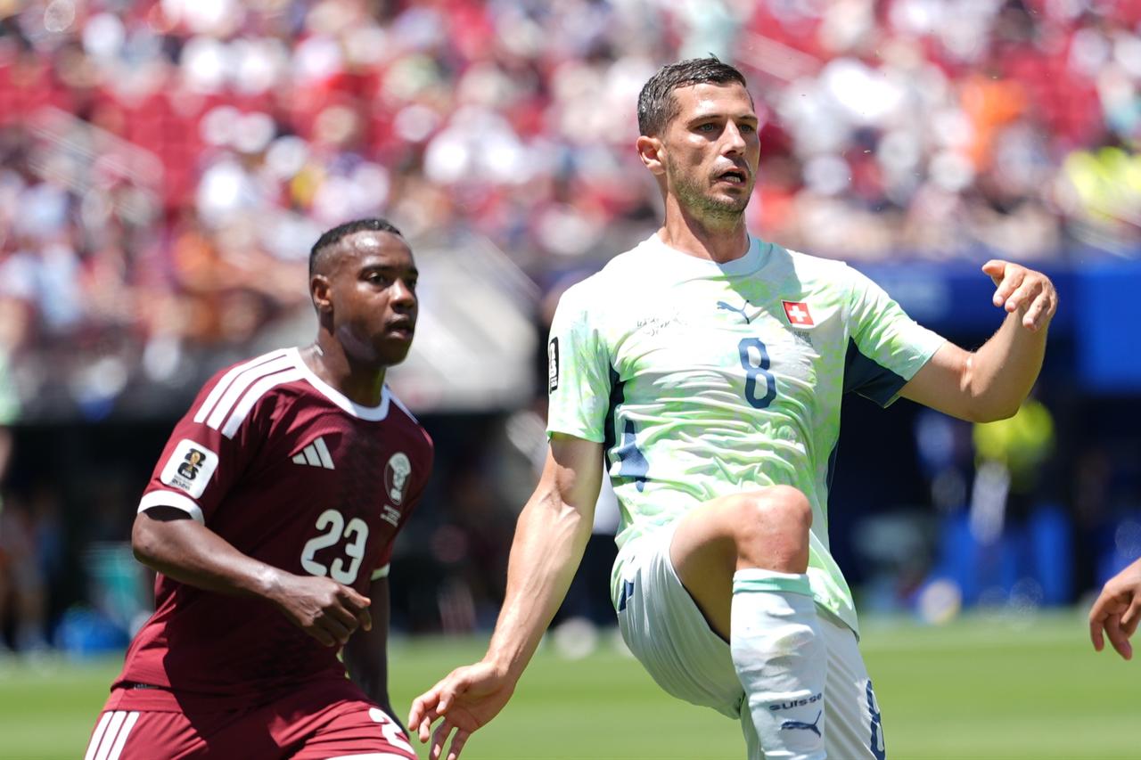 Qatar earns first ever World Cup point with late equaliser against Switzerland