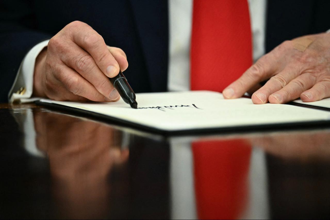 US President Donald Trump signs a proclamation in the Oval Office of the White House in Washington, DC, on June 11, 2026. (AFP Photo)