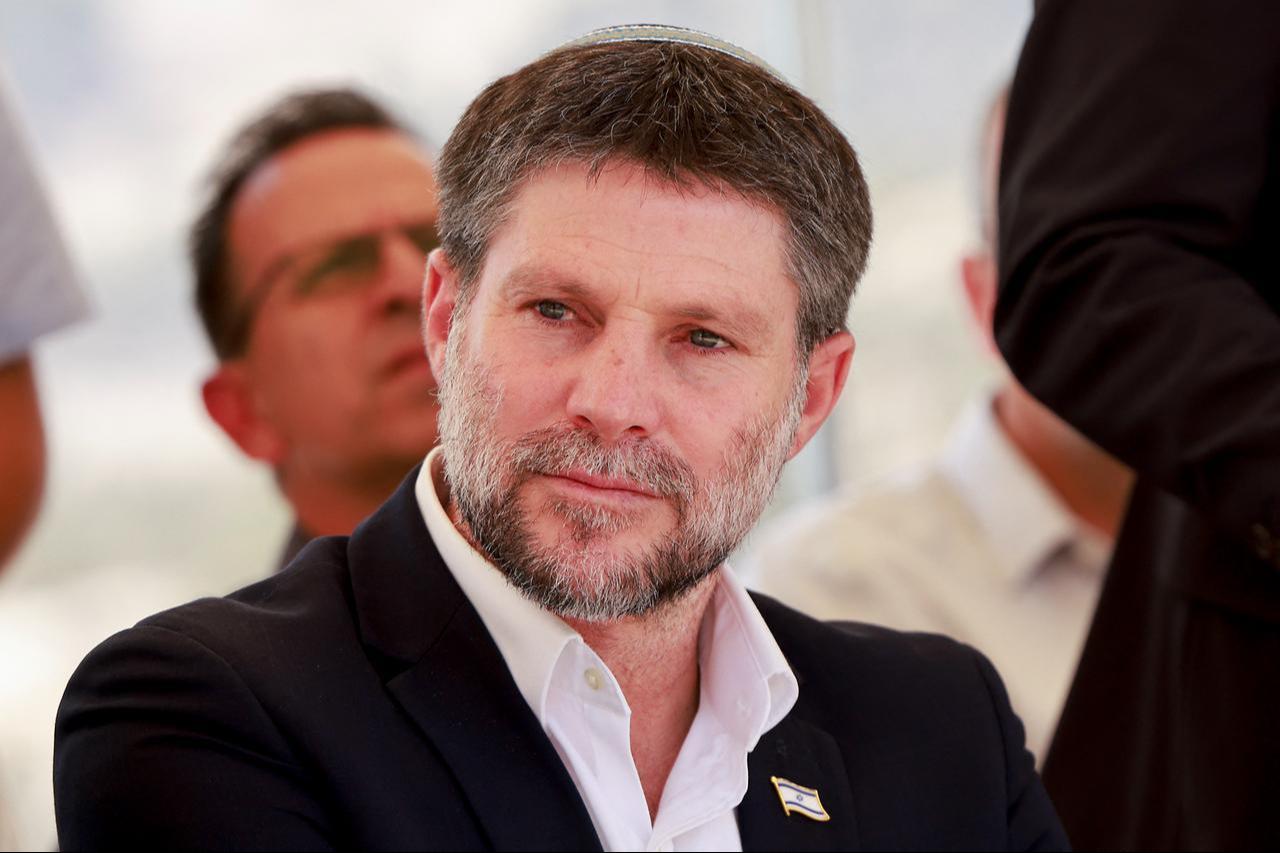 Israeli far-right Finance Minister Bezalel Smotrich sits before a press conference near the settlement of Maale Adumim, in a land corridor known as E1, outside Jerusalem in the occupied West Bank, August 14, 2025. (AFP Photo)