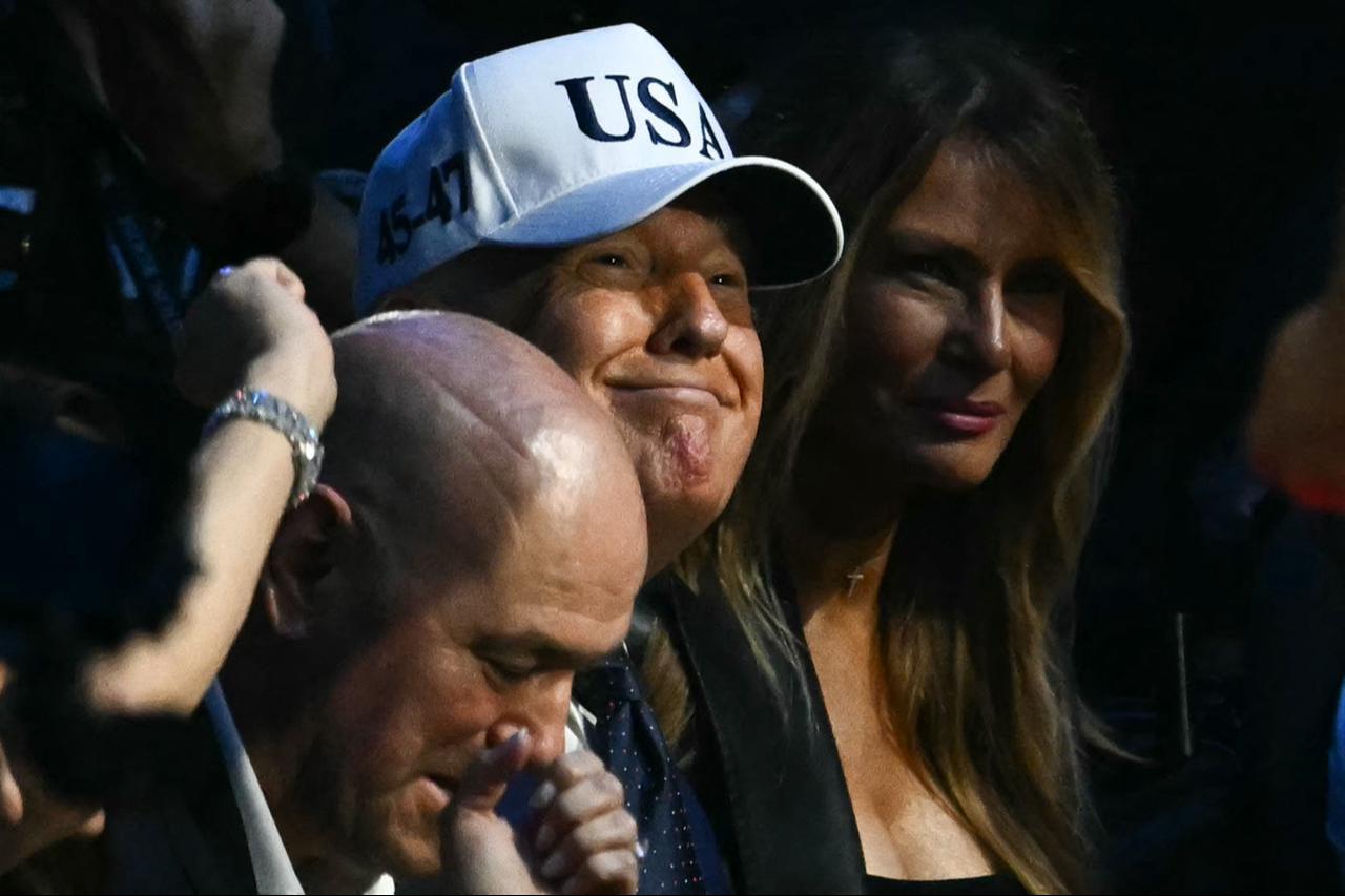 (L/R) UFC CEO Dana White, US President Donald Trump and US First Lady Melania Trump attend the "UFC Freedom 250" mixed martial arts event on the South Lawn of the White House in Washington, DC, June 14, 2026. (AFP Photo)