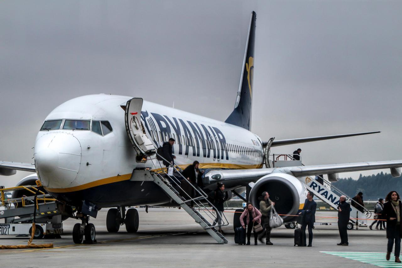 Ryanair passengers getting off the plane at the Porto airport on a cloudy day, Porto, Portugal, January 8, 2020. (Adobe Stock Photo)