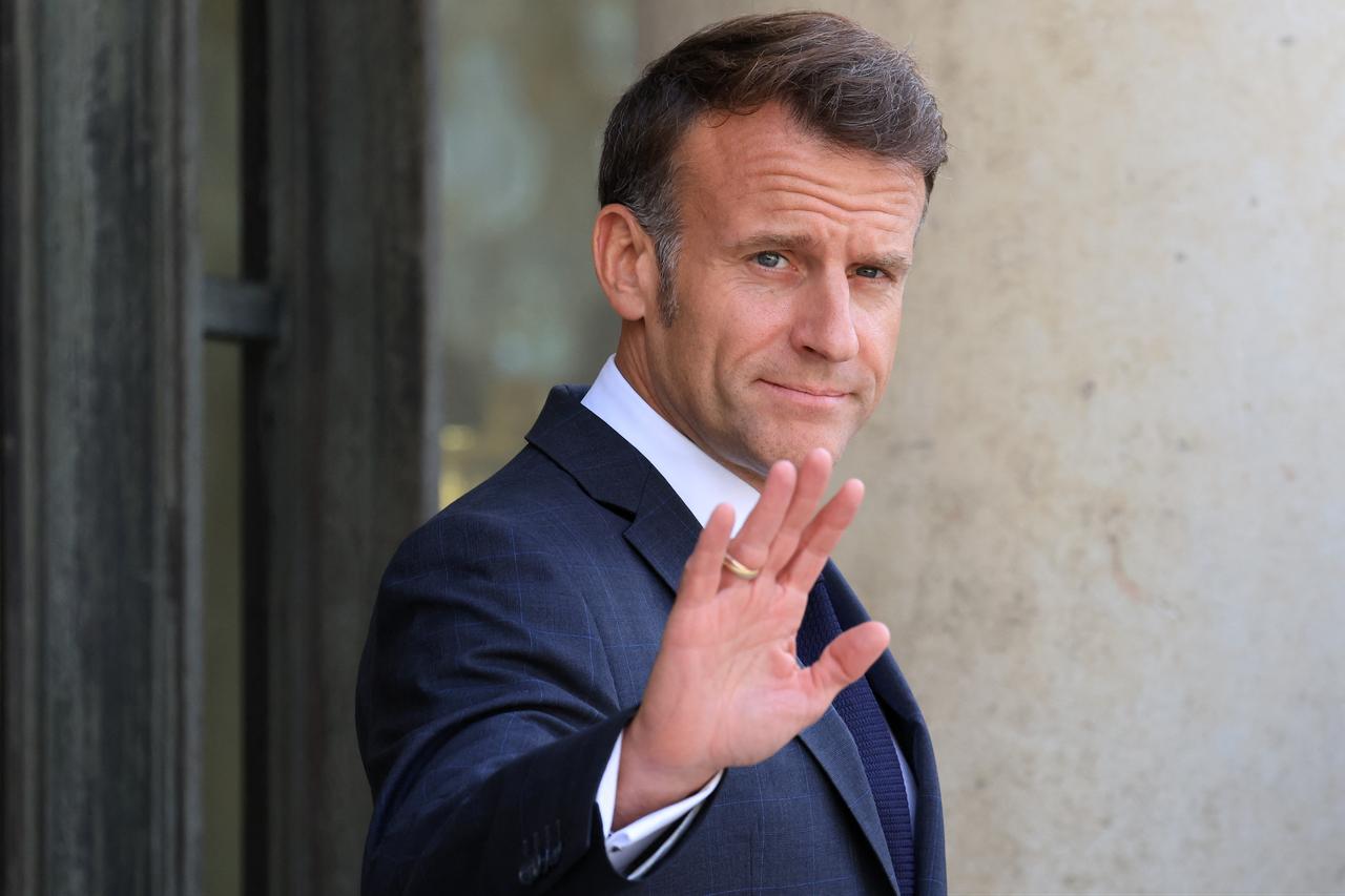 France's President Emmanuel Macron gestures as he arrives to welcome the Canadian Prime Minister Mark Carney (not pictured) to The Elysee Presidential Palace ahead of a bilateral meeting in Paris, France, June 12, 2026. (AFP Photo)