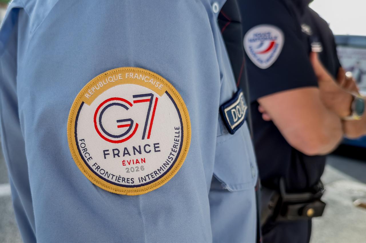 This photograph shows a member of the French Interministerial Border Force (FIR) wearing a G7 bagde in Ferney-Voltaire, at the border between France and Switzerland, ahead of the G7 Summit in Evian, June 11, 2026. (AFP Photo)