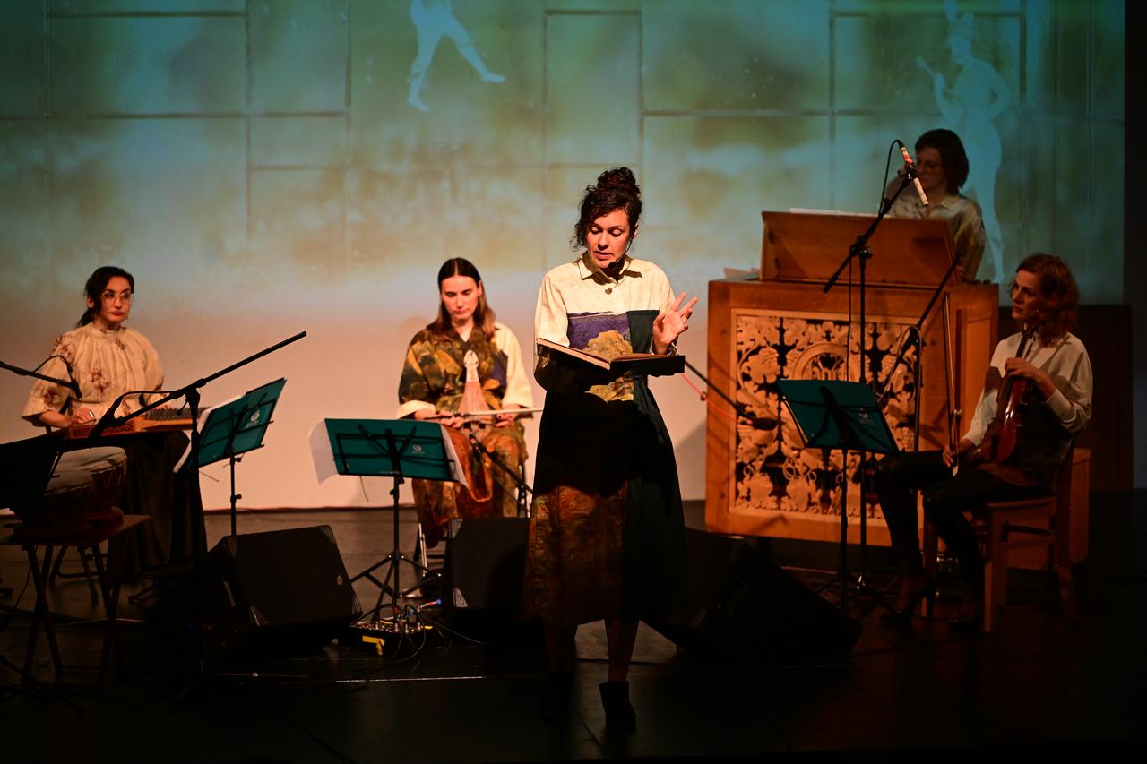 A narrator and musicians take the stage during “Echoing Travelogues: The Beyond and Us,” a London performance inspired by historical travel accounts and cross-cultural encounters. (AA Photo)