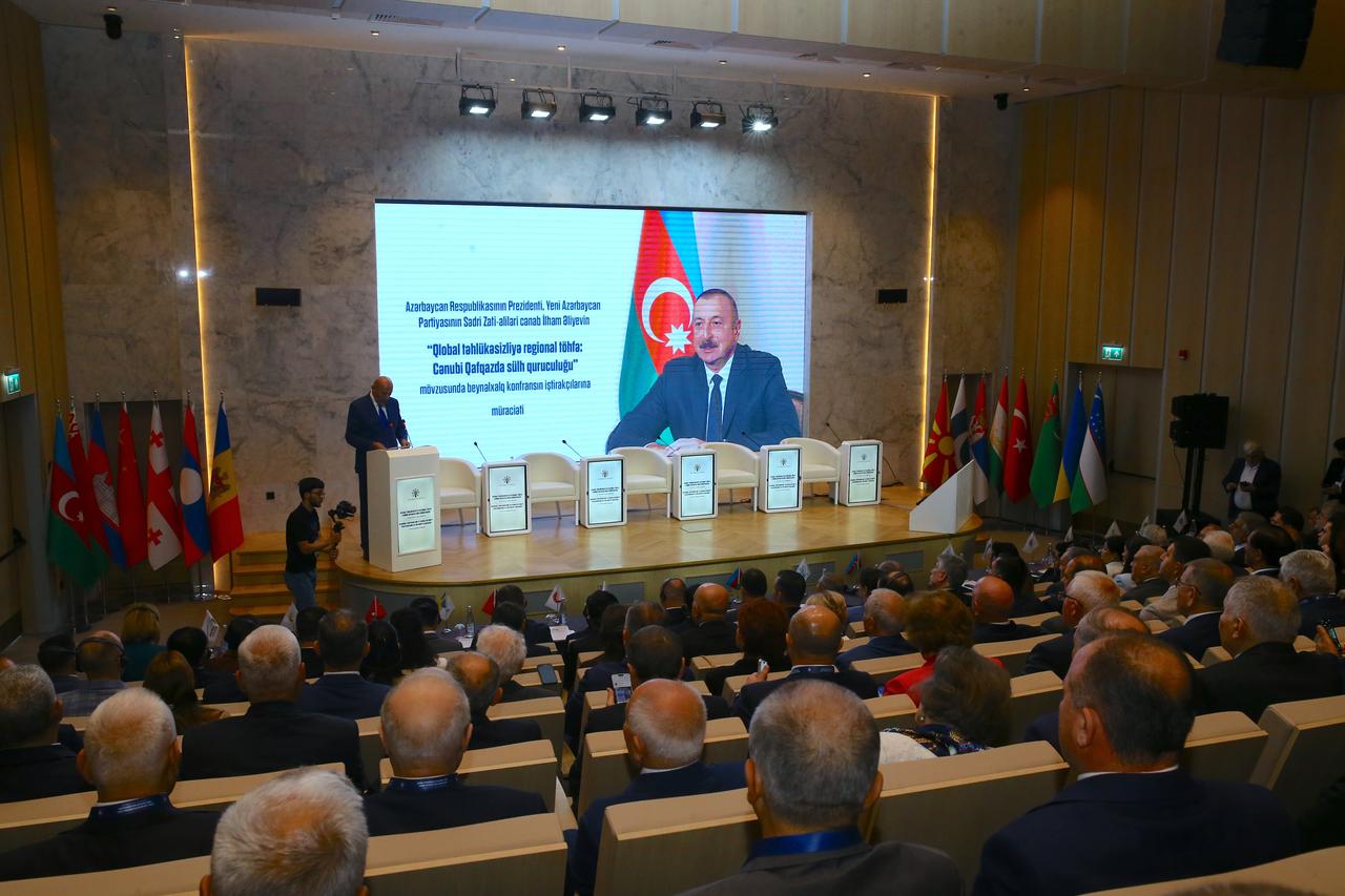 Adalat Valiyev, Head of the Department for Relations with Political Parties and the Legislative Branch of the Presidential Administration of Azerbaijan, read out a message from President Ilham Aliyev addressed to the conference participants in Shusha, Azerbaijan, June 15, 2026. (AA Photo)