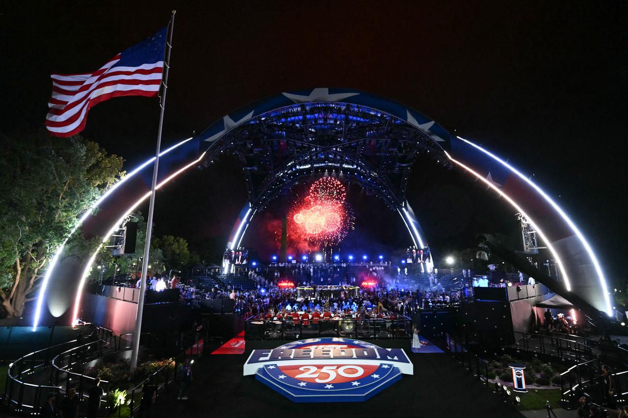 Fireworks go off as America's Justin Gaethje celebrates after defeating Georgia's Ilia Topuria during "UFC Freedom 250" mixed martial arts event on the South Lawn of the White House in Washington, DC, in the early morning hours of June 15, 2026. (AFP Photo)