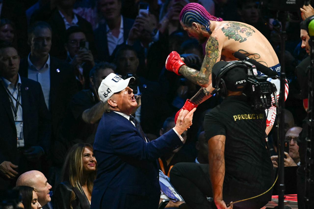 (L/R) US President Donald Trump speaks with America's Sean O'Malley after O'Malley defeated Canada's Aiemann Zahabi during the "UFC Freedom 250" mixed martial arts event on the South Lawn of the White House in Washington, DC, June 14, 2026. (AFP Photo)