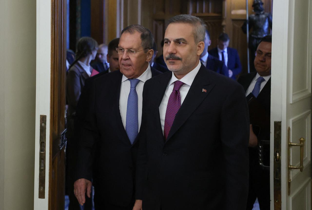 Russian Foreign Minister Sergei Lavrov (L) and his Turkish counterpart Hakan Fidan (R) enter a hall during their meeting in Moscow, Russia, June 16, 2026. (AFP Photo)