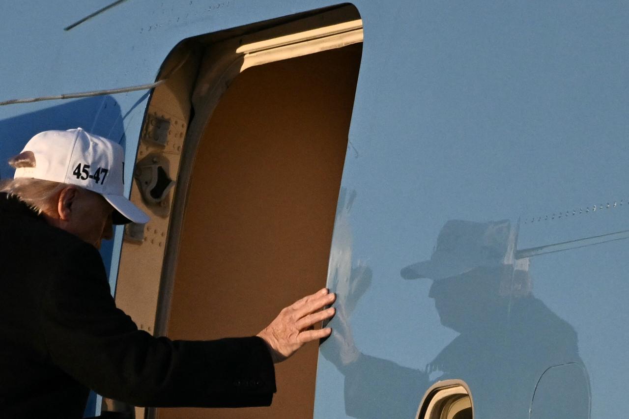 US President Donald Trump boards Air Force One as he departs Joint Base Andrews in Maryland on March 13, 2026. (AFP Photo)