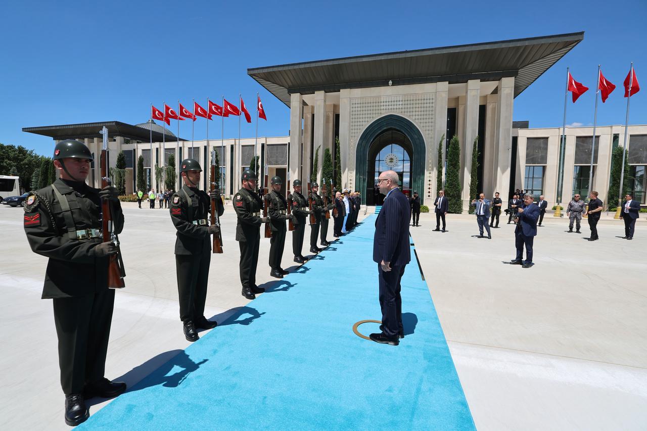 President Recep Tayyip Erdogan salutes the honor guard during the "Ankara Airport and Connection Roads Opening Ceremony" at Ankara Airport in Ankara, June 15, 2026. (Photo via Turkish Presidency/Murat Cetinmuhurdar)