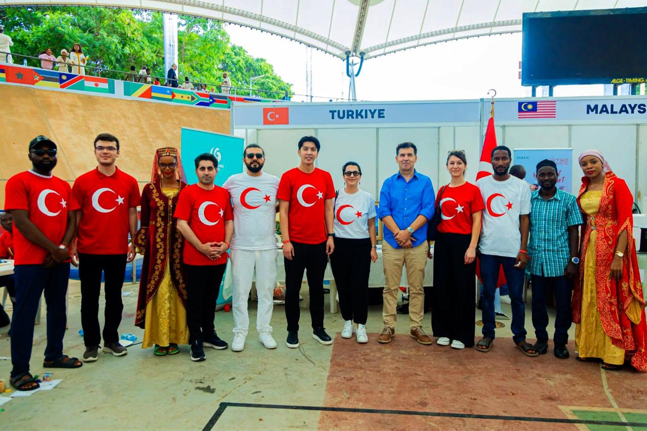 Visitors and representatives pose at Türkiye’s stand during the annual Diplomatic Cultural Festival in Abuja, Nigeria, June 15, 2026. (AA Photo)