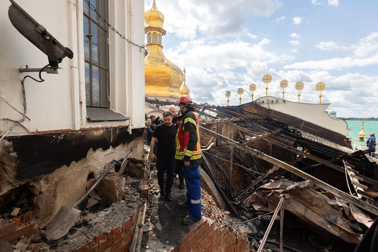 Ukraine's President Volodymyr Zelenskyy (C) visiting Dormition Cathedral in the Orthodox complex of the Kyiv Pechersk Lavra on June 15, 2026.(Photo via UKRAINIAN PRESIDENTIAL PRESS SERVICE / AFP)