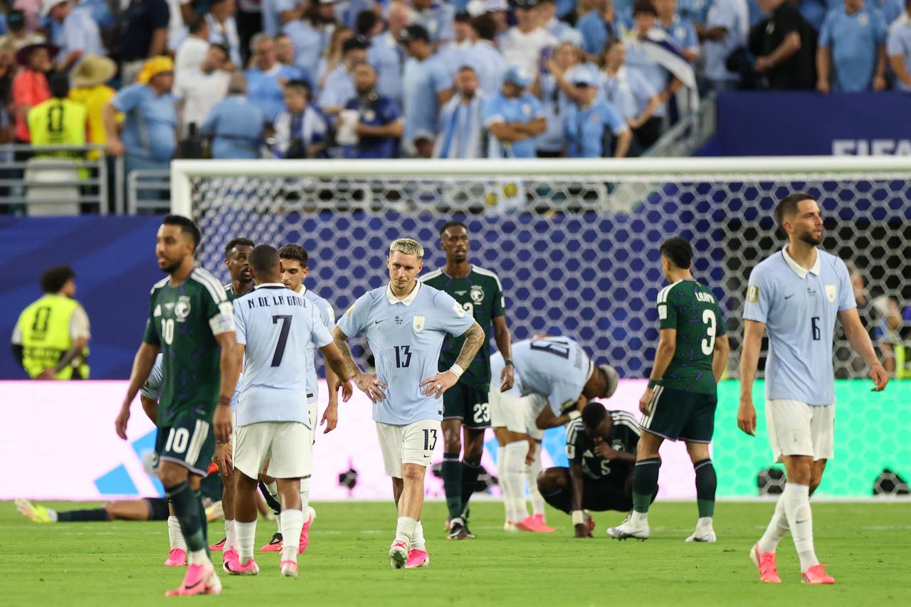 Uruguay's defender #13 Guillermo Varela reacts at the end of the 2026 World Cup Group H football match between Saudi Arabia and Uruguay at the Miami Stadium in Miami, United States, on June 15, 2026.  (AFP Photo)