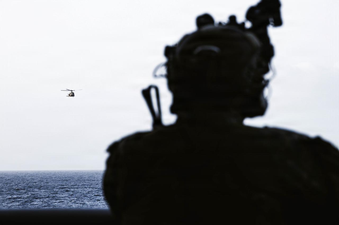 U.S. Marines fire rifles at simulated targets from of a UH-1Y Venom during aerial sniper and close air support training in the CENTCOM area of responsibility, May 31, 2026. (Photo via U.S. Marine Corps)