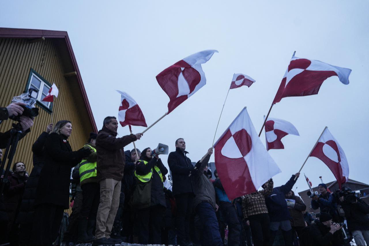 People wave Greenlandic flags as they take part in a demonstration that gathered to protest against the US President's plans to take Greenland, in Nuuk, Greenland, January 17, 2026. (AFP Photo)