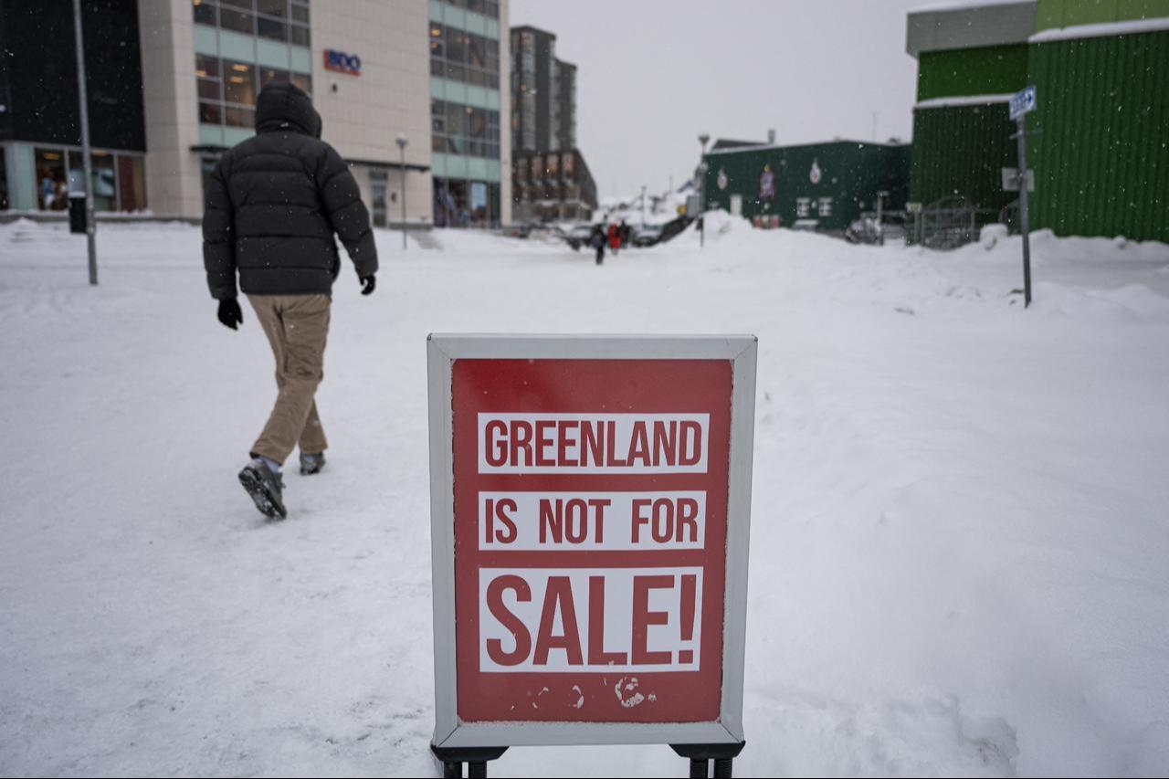 A large sale style sign reading “Greenland is not for sale” is pictured outside of a clothing shop in Nuuk, Greenland, January 19, 2026. (AFP Photo)