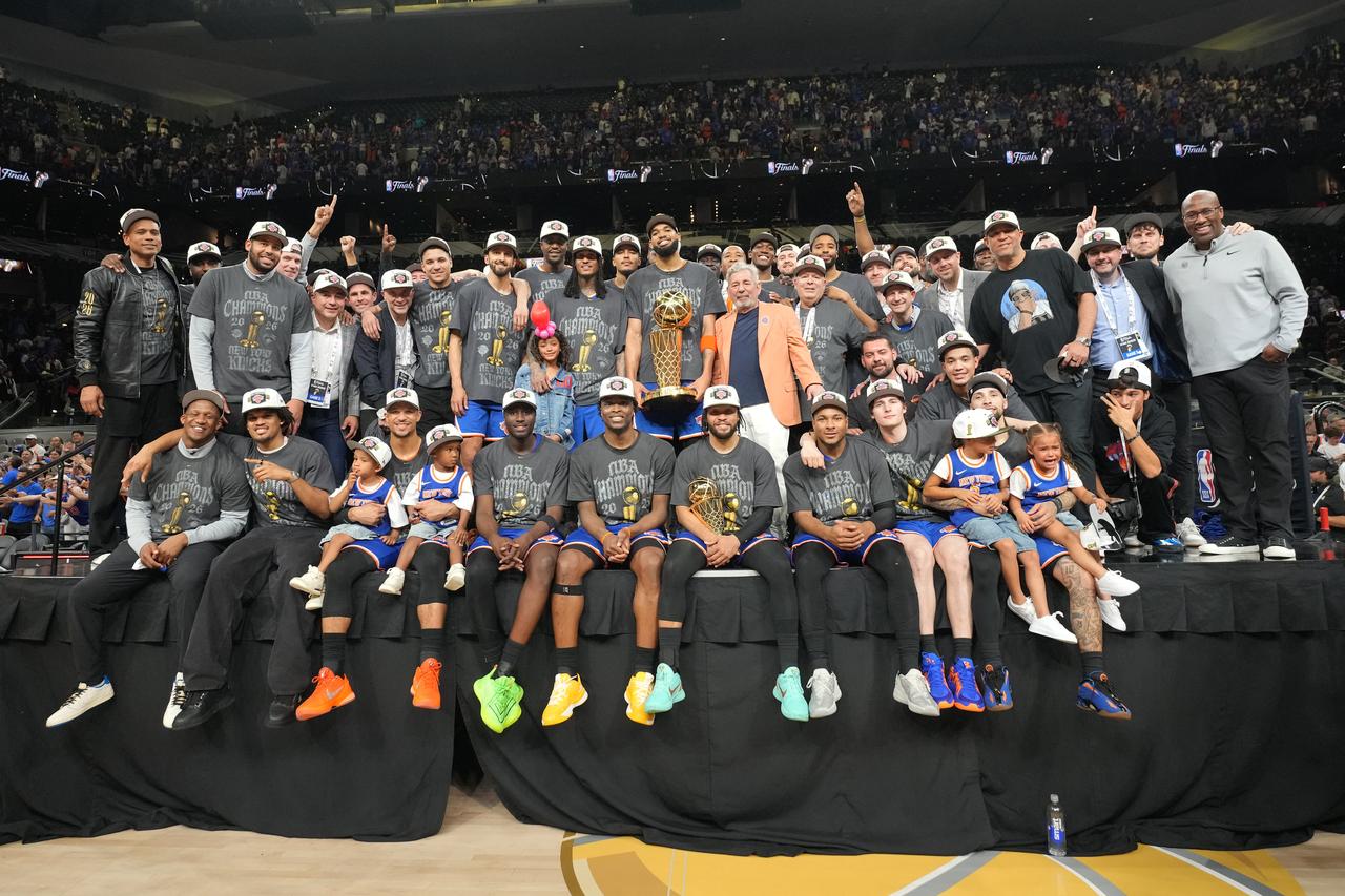 The New York Knicks pose for a team photo after winning the Larry O'Brien Championship Trophy during Game Five of the 2026 NBA Finals on June 13, 2026 at Frost Bank Center in San Antonio, Texas. (AA Photo)