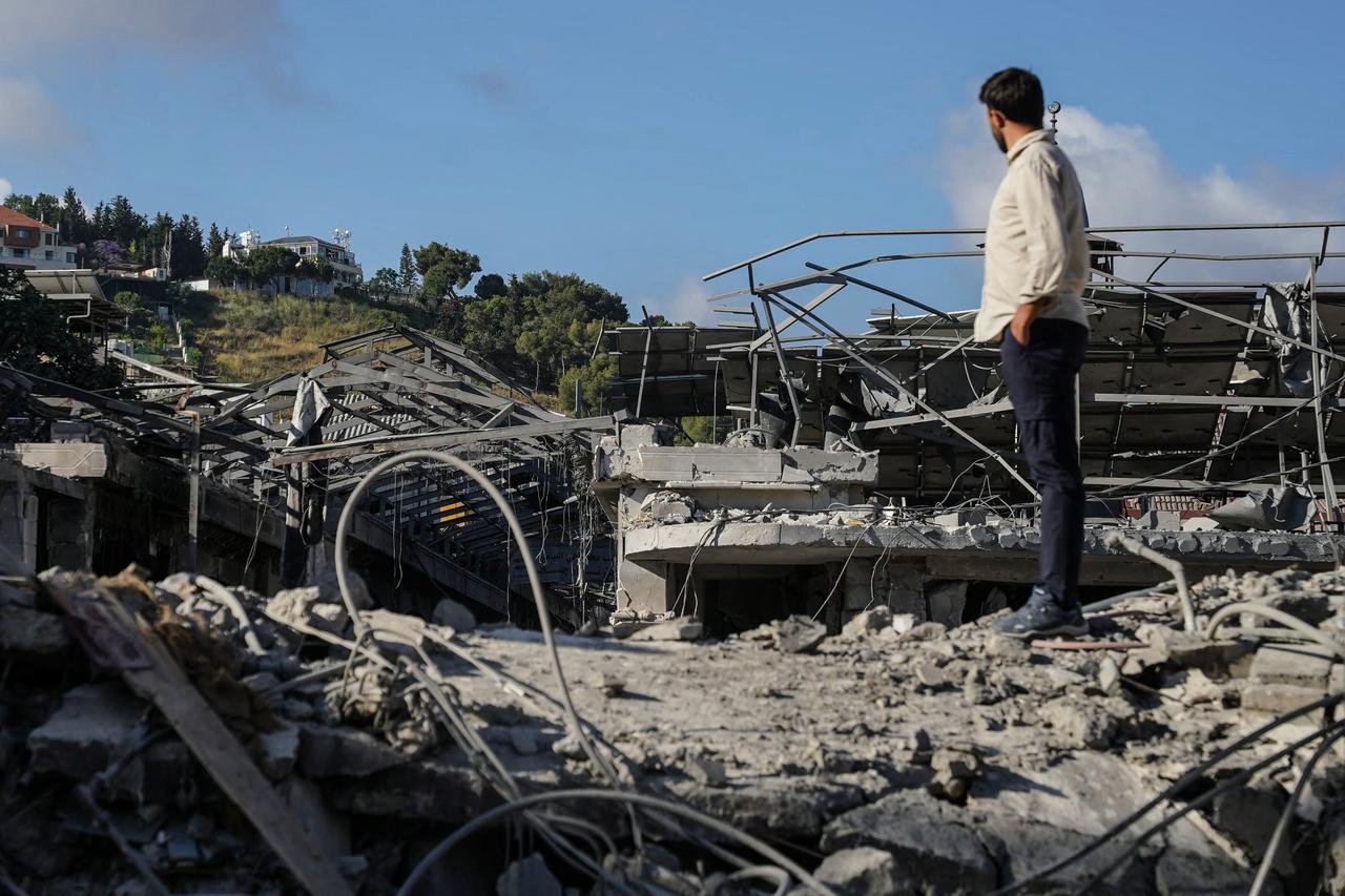 A man stands on the rubble of destroyed buildings in Nabatieh, Lebanon on June 15, 2026. (AFP Photo)
