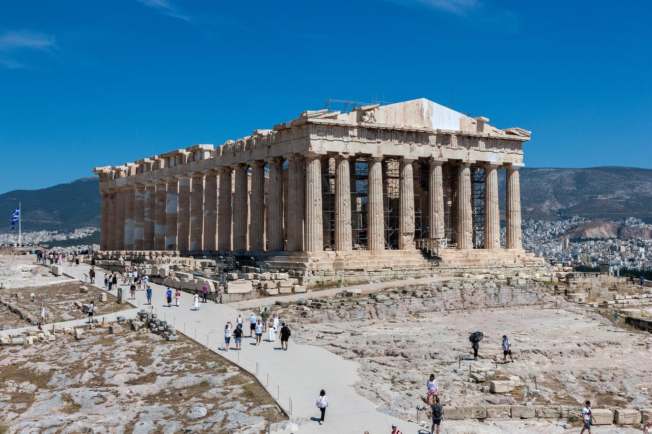 Visitors walk near the Parthenon on the Acropolis in Athens after the restoration of the monument's western facade. (Photo via Greek Culture Ministry)