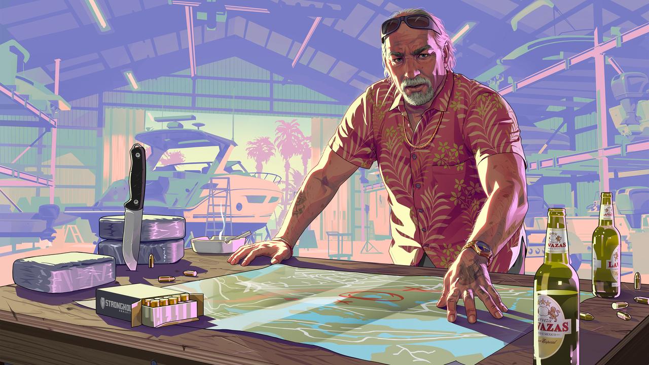 Grand Theft Auto VI character Brian Heder stands over a map in a  promotional image. (Photo via Rockstar Games)