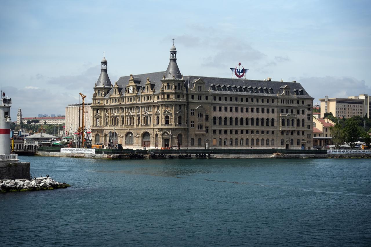 A closer view shows Haydarpasa Railway Station's restored facade, towers and roofline along Istanbul's shoreline. (IHA Photo)