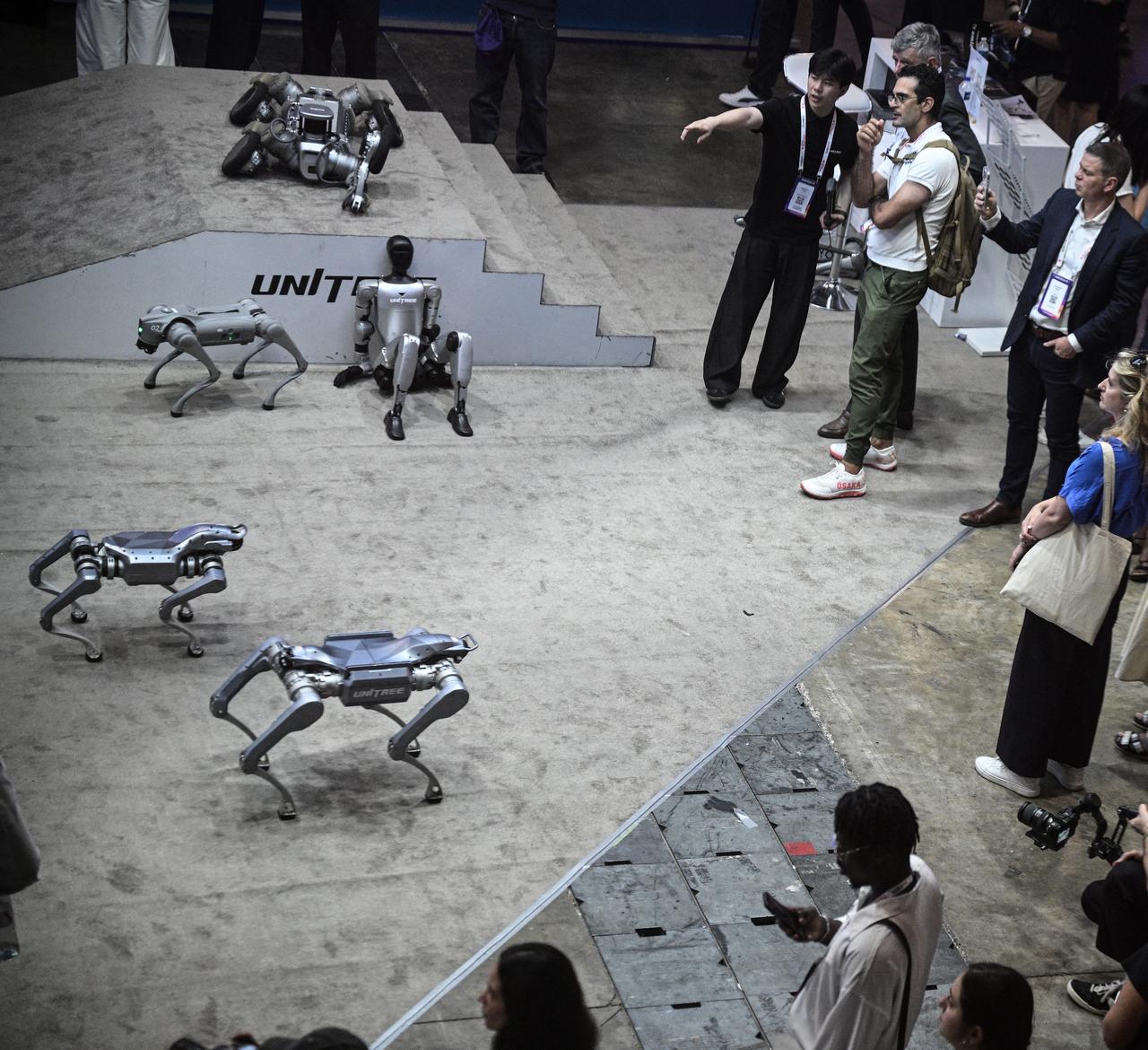 Visitors look at robots by Unitree Robotics company at the VivaTech technology startups and innovation fair at the Paris Expo Porte de Versailles, in Paris on June 17, 2026. (AFP Photo)
