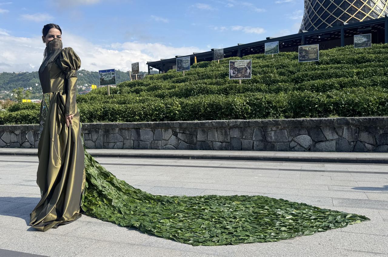 Iranian university student Yeganeh Choulaki poses in Rize, Türkiye, with a handmade dress she designed using around 5,000 fresh tea leaves. (AA Photo)