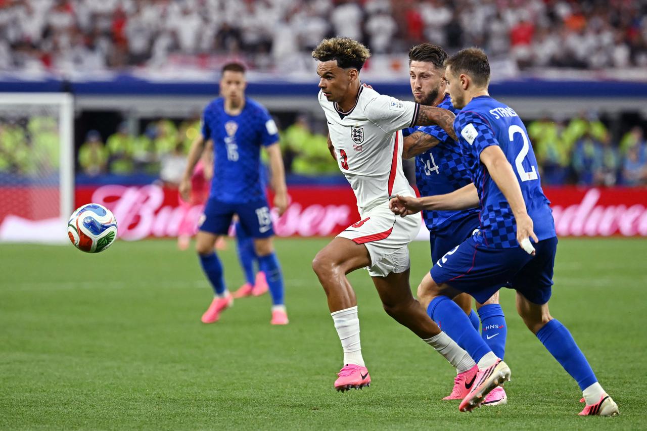 England's defender #03 Nico O'Reilly (L) fights for the ball with Croatia's forward #24 Marco Pasalic (C) and Croatia's defender #02 Josip Stanisic (R)  during the 2026 World Cup Group L football match between England and Croatia at the Dallas Stadium in Arlington, Texas, on June 17, 2026. (AFP Photo)
