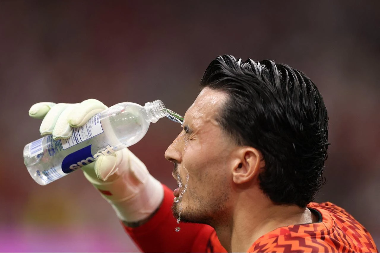 Ugurcan Cakir #23 of Turkiye pours water on his face during the warm-up before the FIFA World Cup 2026 Group D match between Australia and Türkiye at BC Place, on June 13, 2026, in Vancouver, Canada. (AFP Photo)