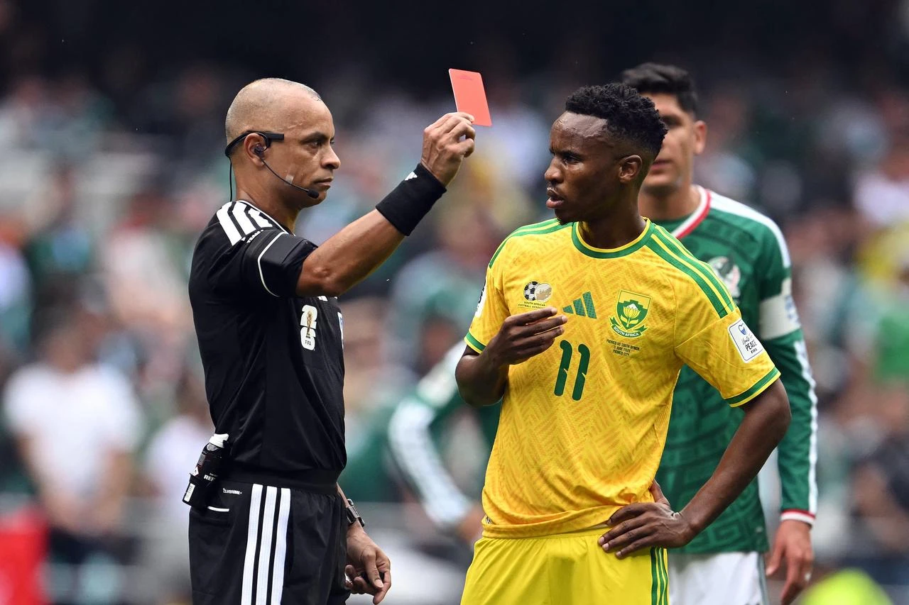 Brazilian referee Wilton Sampaio shows a red card to South Africa's midfielder #11 Themba Zwane during the 2026 World Cup Group A football match between Mexico and South Africa at the Mexico City Stadium in Mexico City on June 11, 2026. (AFP Photo)