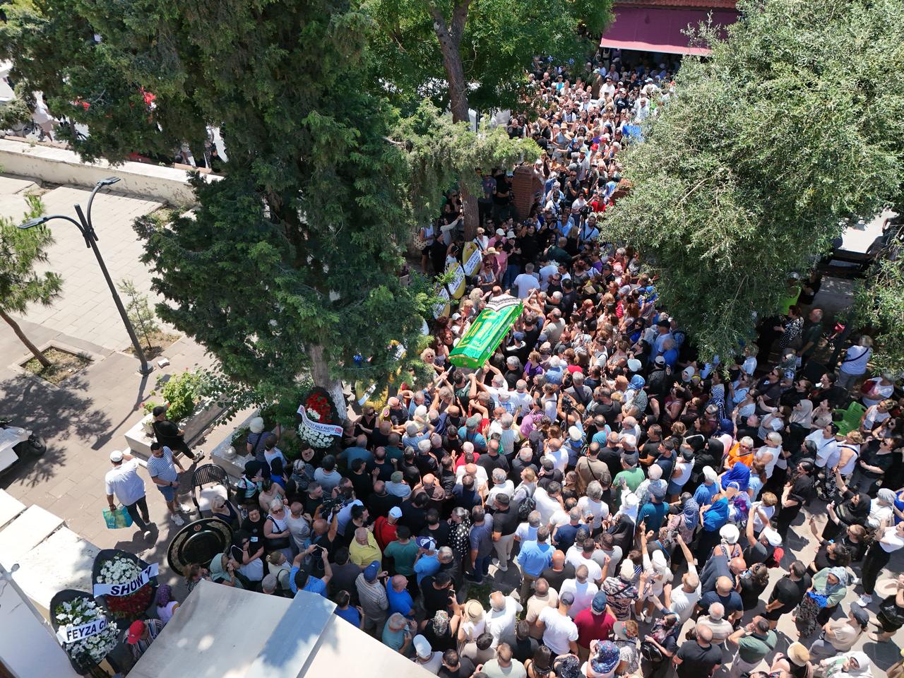 An aerial view shows mourners gathering around the coffin of Turkish actress Ece Irtem during her funeral ceremony at Hanim Mosque in Kusadasi, Aydin, western Türkiye. (AA Photo)