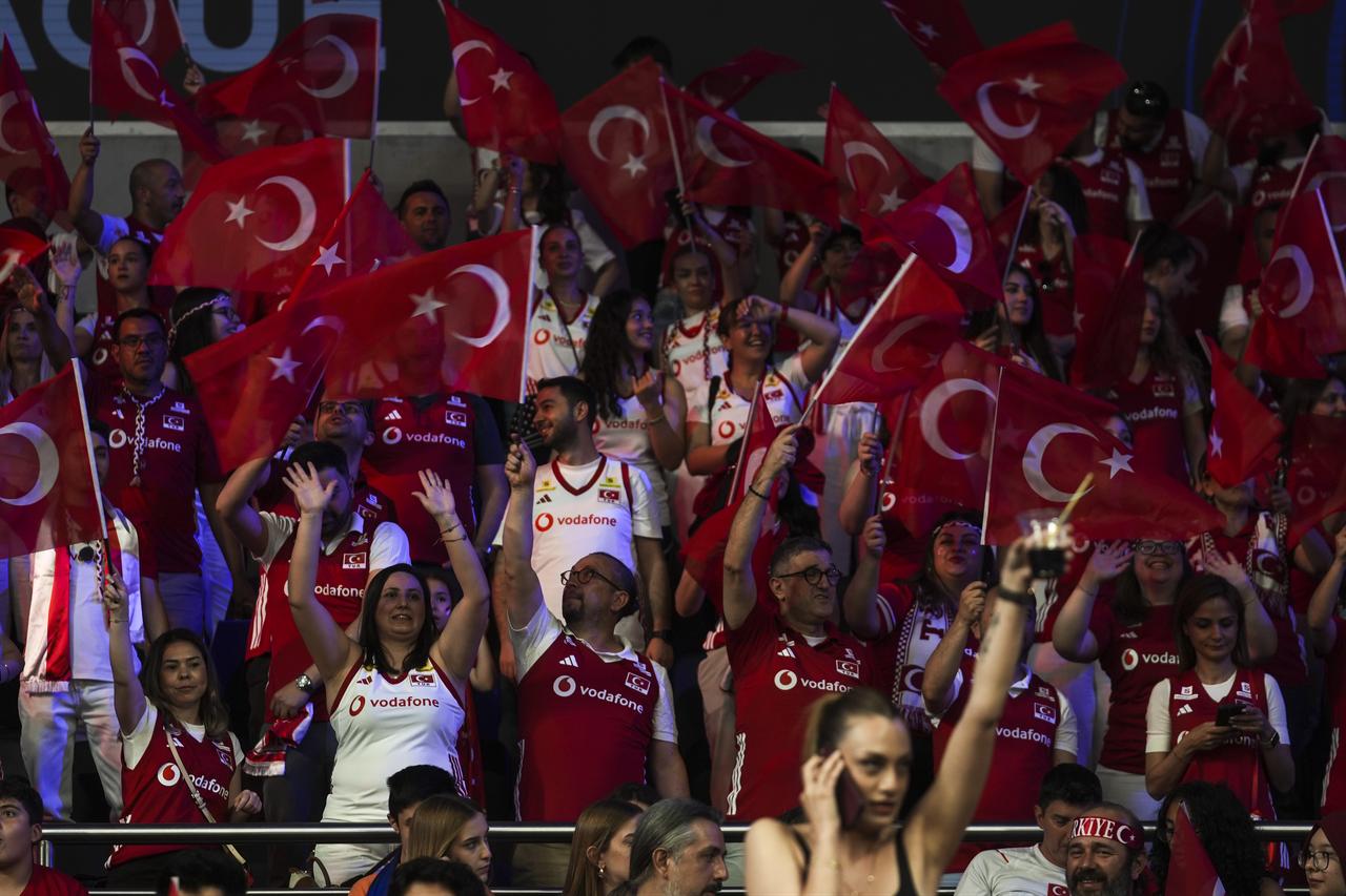 Türkiye fans wave Turkish flags during the 2026 FIVB Women’s Volleyball Nations League match against Belgium at Ankara Sports Hall in Ankara, Türkiye, June 17, 2026. (AA Photo)