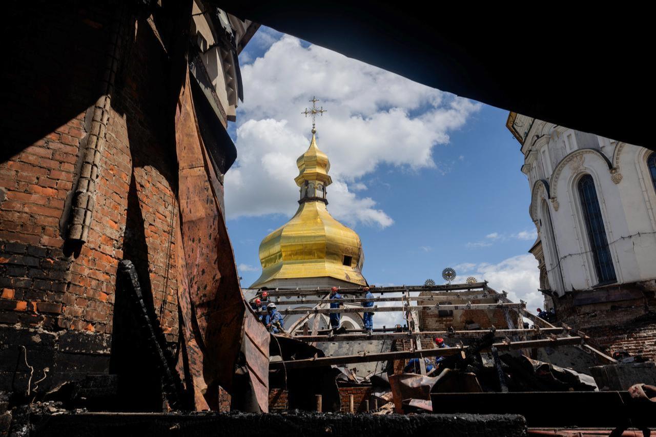 Ukrainian firefighters work at the roof of the damaged Dormition Cathedral in the Orthodox complex of the Kyiv Pechersk Lavra following a Russian strike in Kyiv, June 15, 2026. (AFP Photo)