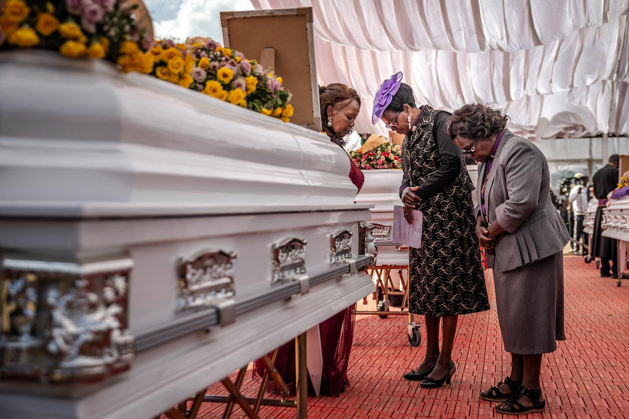 Women clergy pray in front of the coffin of a victim of the Utumishi Girls' Academy Senior School fire as they join prayers with religious leaders from several denominations during a memorial mass in Gilgil, Kenya, on June 12, 2026. (AFP Photo)