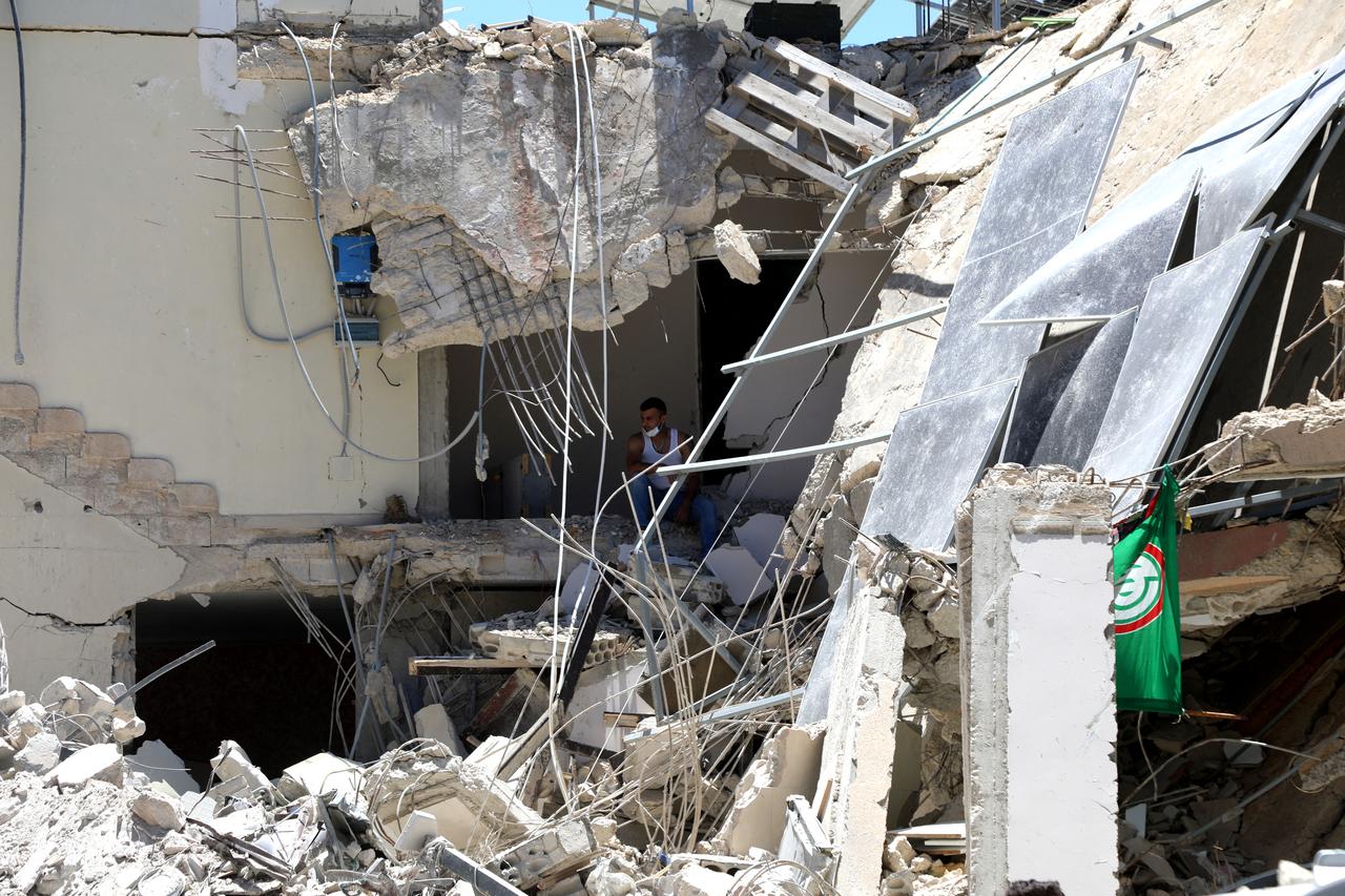 A Lebanese man checks the site of an Israeli attack that destroyed houses and carpentry shops in the village of Al-Qlailah in the Tyre district in southern Lebanon, June 19, 2026. (AFP Photo)