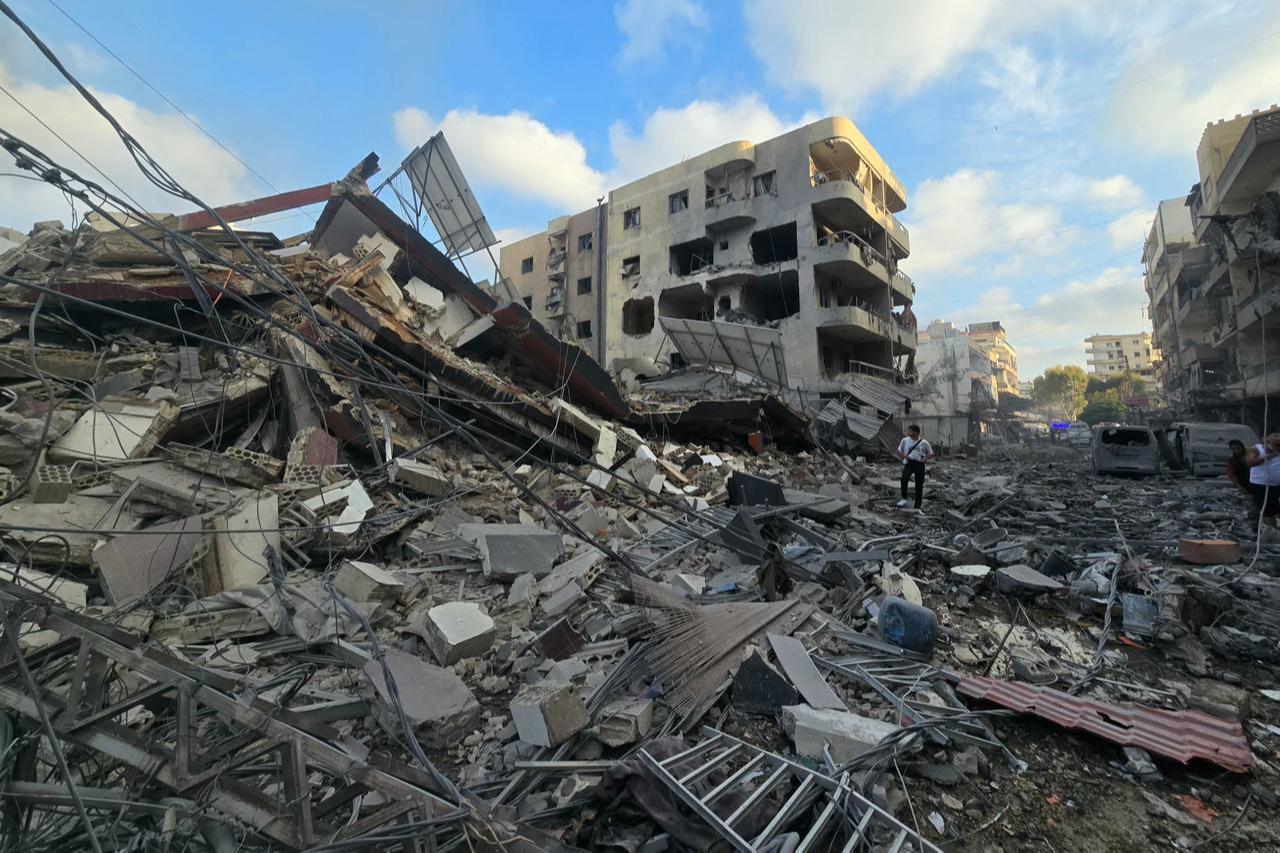 People gather at the site of an Israeli strike that hit near a hospital in the southern Lebanese city of Tyre on June 1, 2026. (AFP Photo)