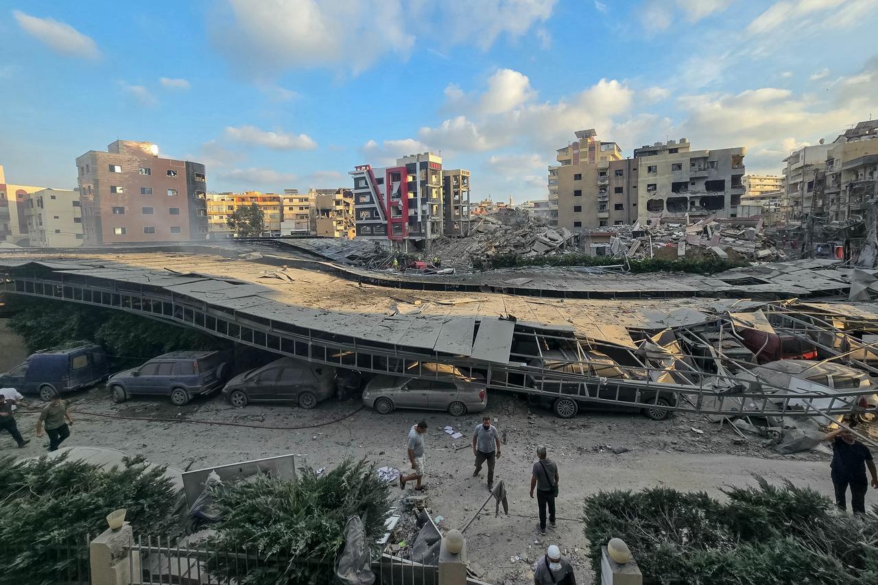 People gather at the site of an Israeli strike that hit near a hospital in the southern Lebanese city of Tyre on June 1, 2026. (AFP Photo)