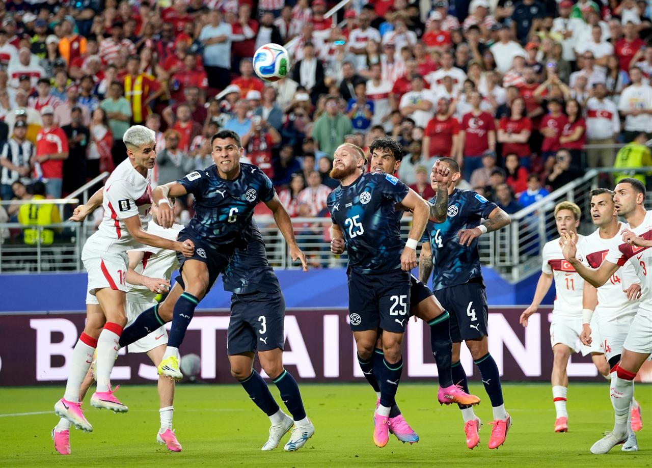 Mert Muldur (L) of Türkiye in action against Junior Alonso (6) of Paraguay during the 2026 FIFA World Cup First Stage Group D match between Türkiye and Paraguay at the San Francisco Bay Area Stadium in Santa Clara, California, USA, June 19, 2026. (AA Photo)