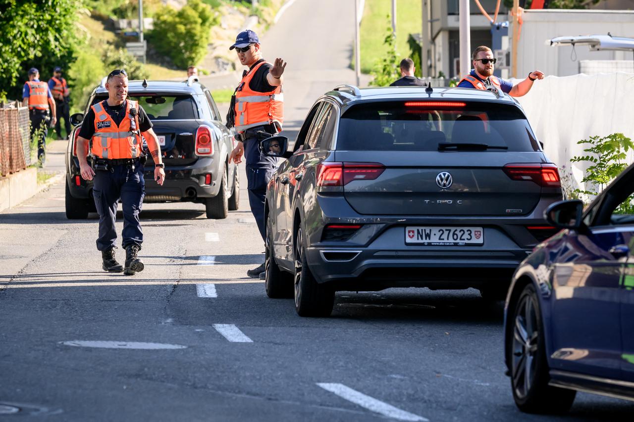 Police officers secure the access to the Burgenstock luxury hotel complex above Lake Lucerne, where talks following up on a deal to end the Middle East conflict were scheduled to begin, June 19, 2026. (AFP Photo)