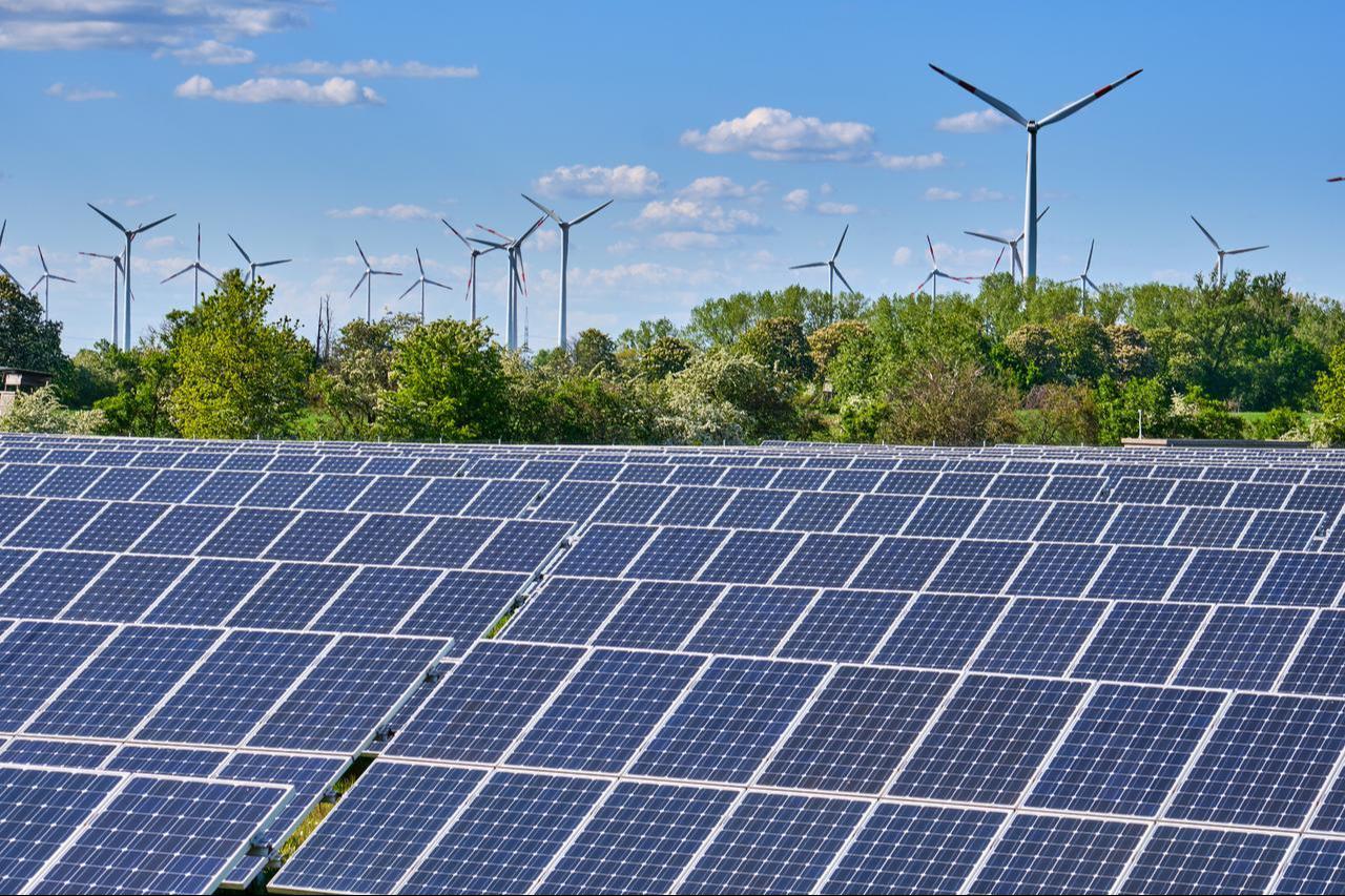 Solar panels and wind turbines are seen at a renewable energy site in Germany. (Adobe Stock Photo)
