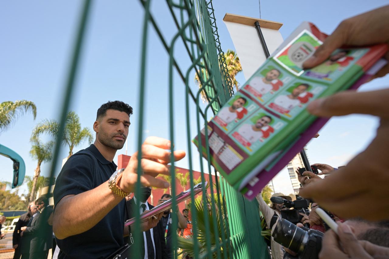 Iran’s forward #09 Mehdi Taremi signs a Panini album before he and the team’s players leave for the US at the Marriott Hotel in Tijuana, Mexico, on June 20, 2026. (AFP Photo)