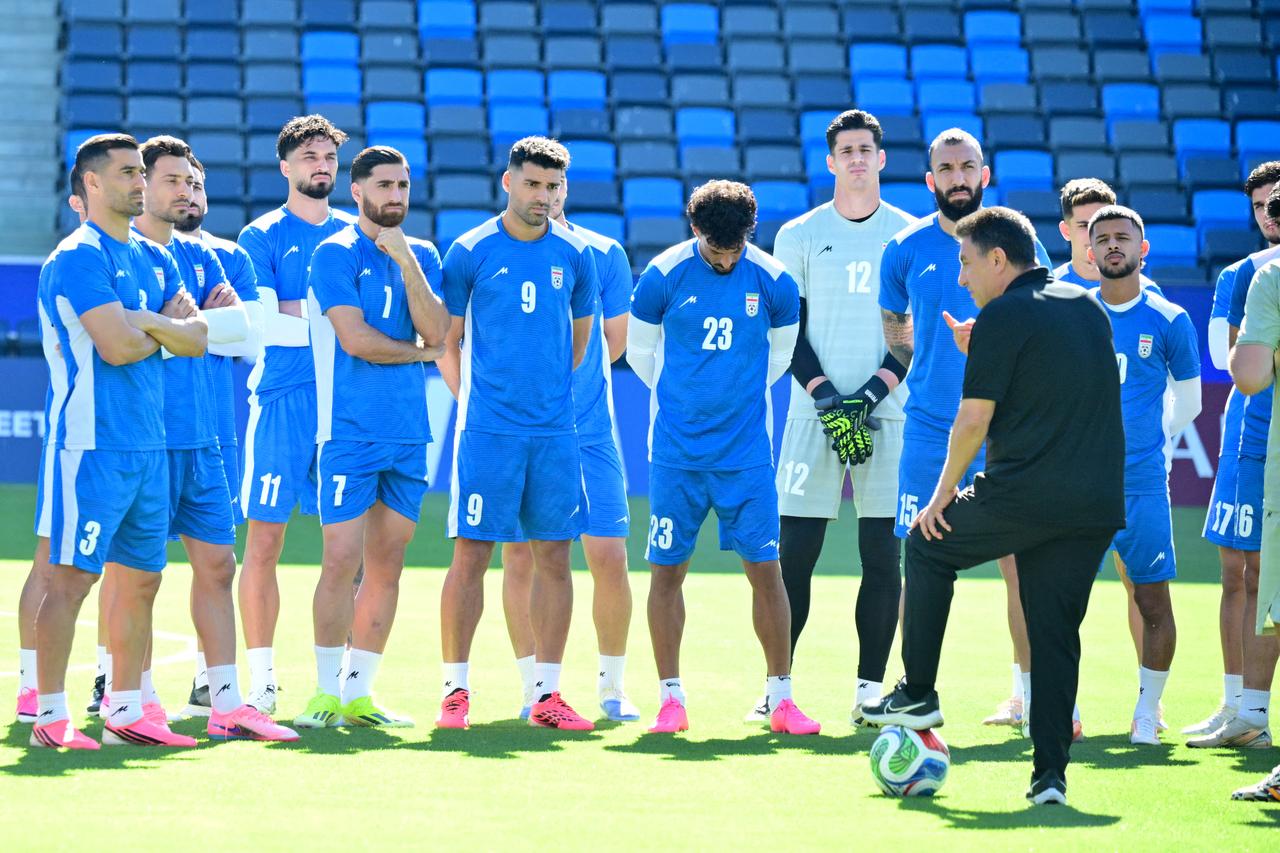 Iran's head coach Amir Ghalenoei speaks to his players during an MD-1 training session at Carson Sports Park in Carson, on June 20, 2026. (AFP Photo)