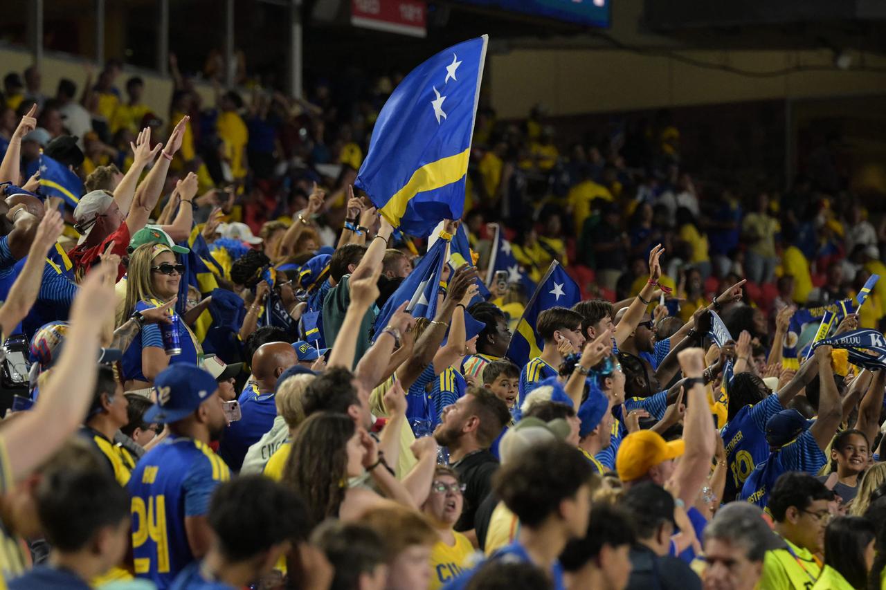 Curacao's fans celebrate at the end of the match between Ecuador and Curacao on June 20, 2026.  (AFP Photo)