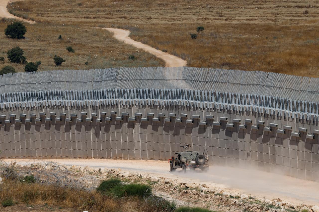 An Israeli army Humvee vehicle patrols along the northern border with Lebanon in the Upper Galilee on June 18, 2026. (AFP Photo)
