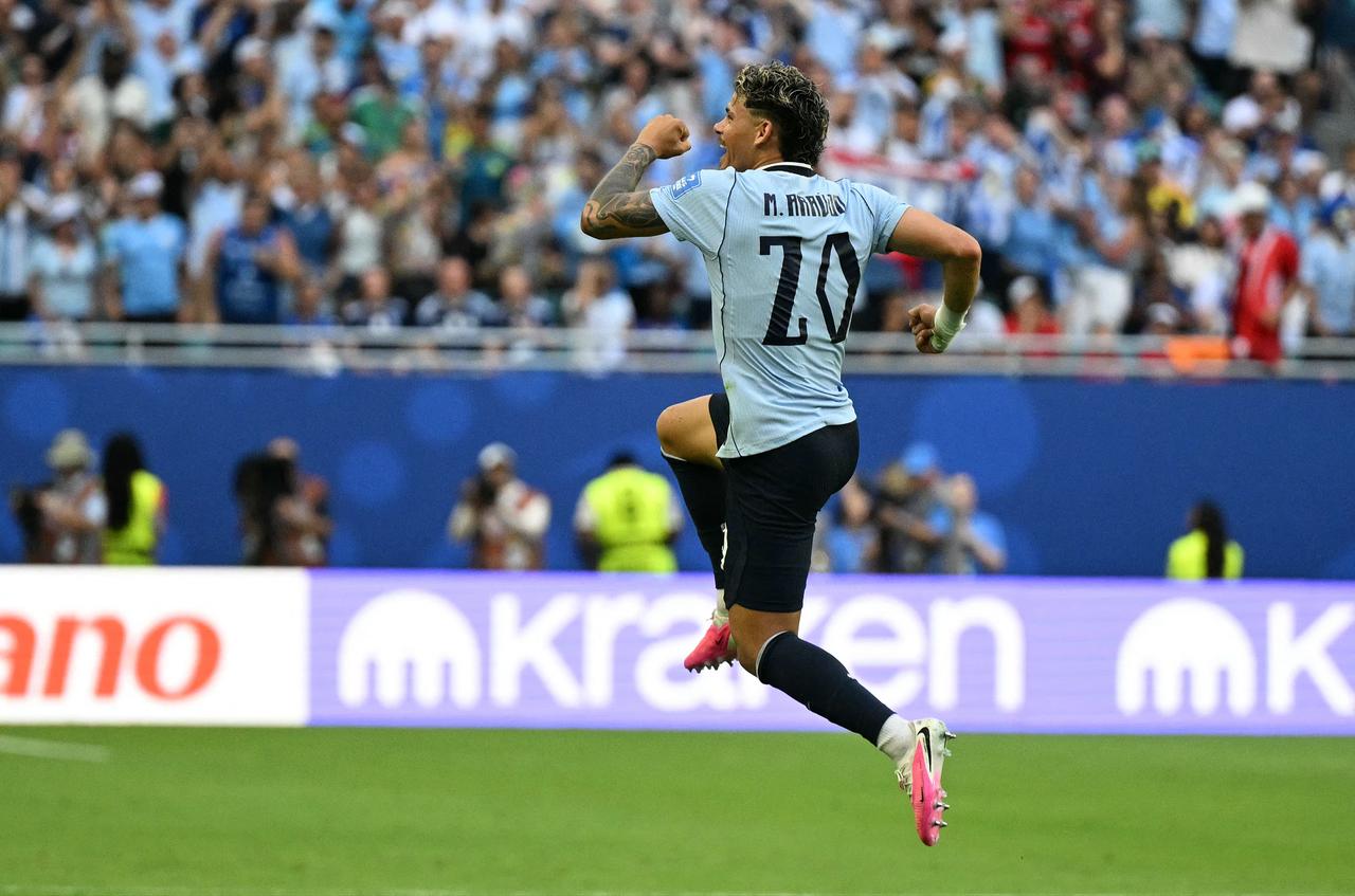 Uruguay's midfielder #20 Maximiliano Araujo celebrates scoring his team's first goal during the 2026 World Cup Group H football match between Uruguay and Cape Verde at the Miami Stadium in Miami Gardens, FL, on June 21, 2026. (AFP Photo)